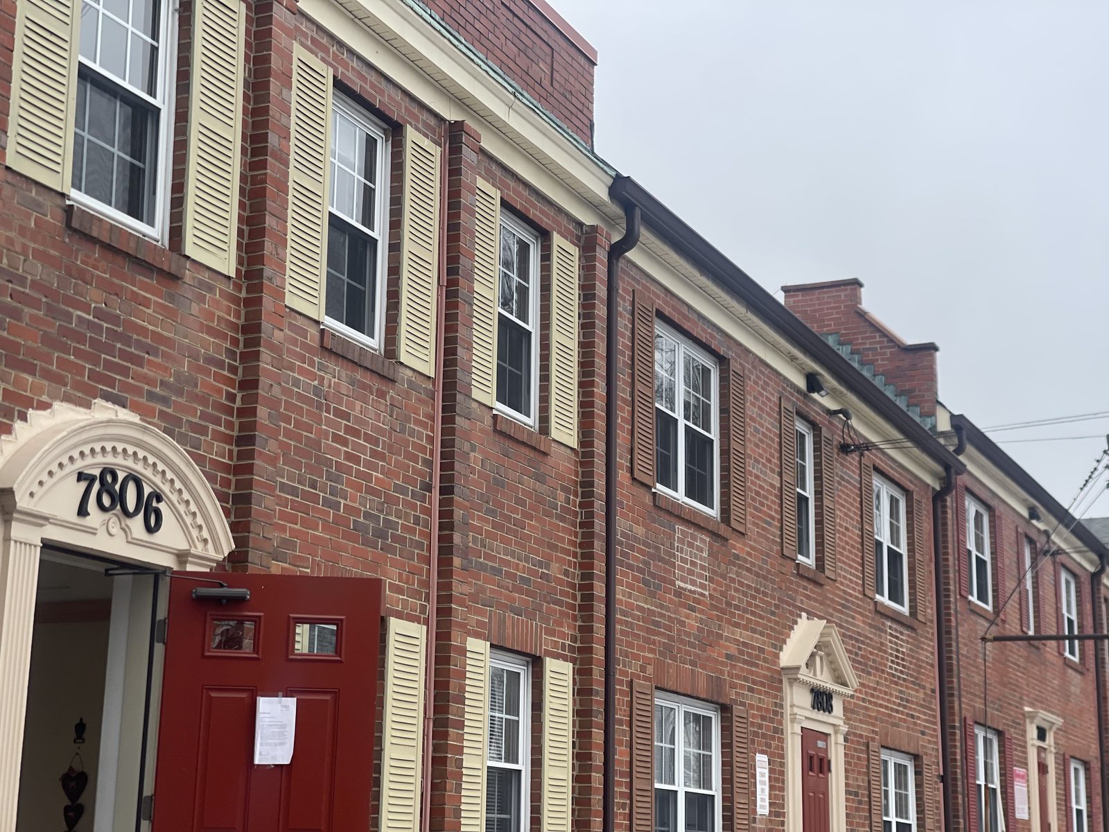Front of red brick townhouse apartments